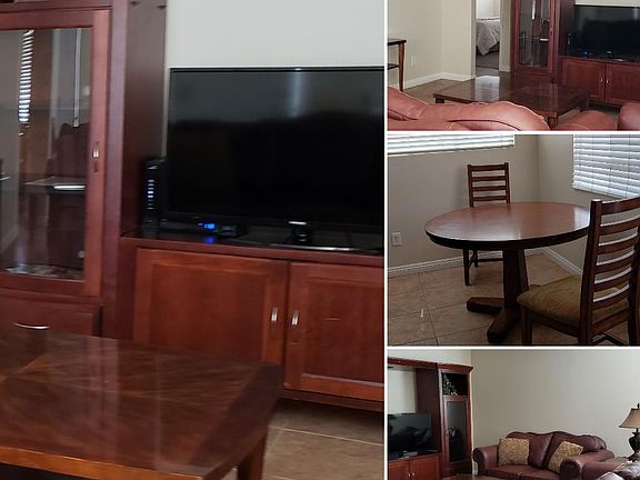 Family room with TV, cable, internet, leather sofa set, coffee and end table. Extra table behind sofa.