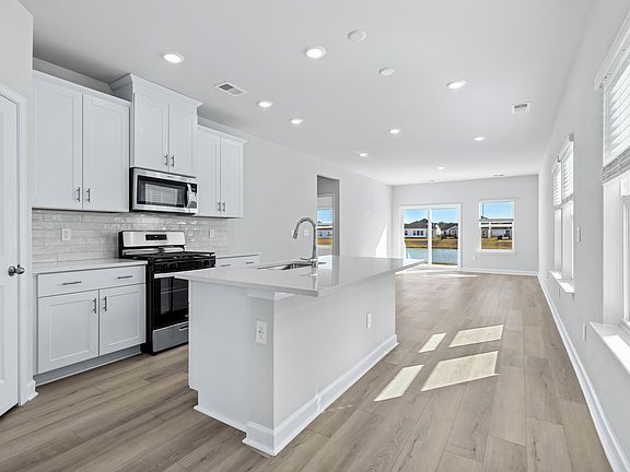 The kitchen overlooks the dining area and great room.