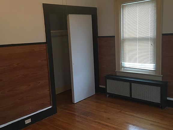 Master bedroom includes hardwood floors, a large closet and ceiling fan.