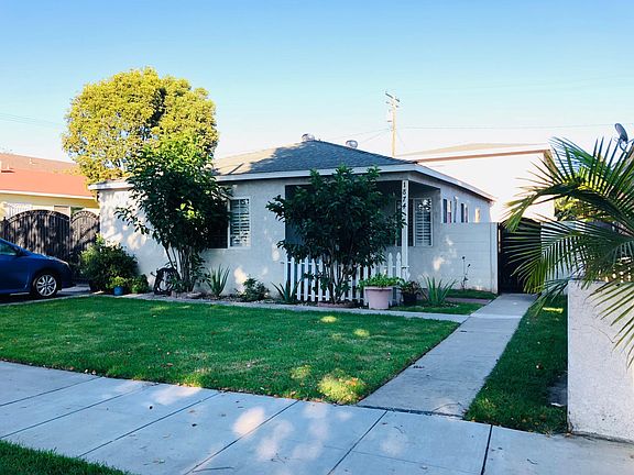 Curb view of the property, unit is behind front house.
