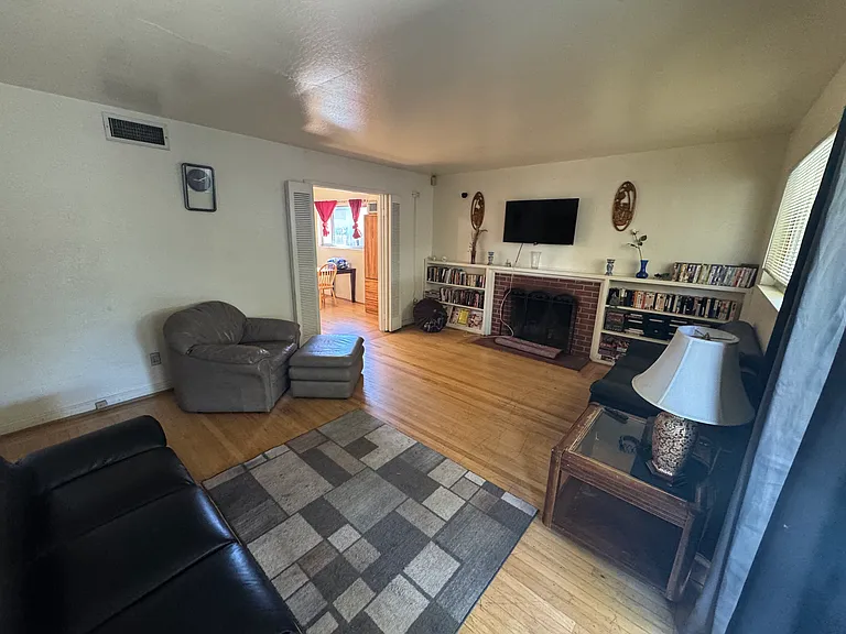 Living room, leading into dining room