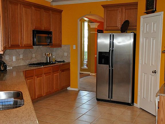 Notice the gas range and built in microwave.