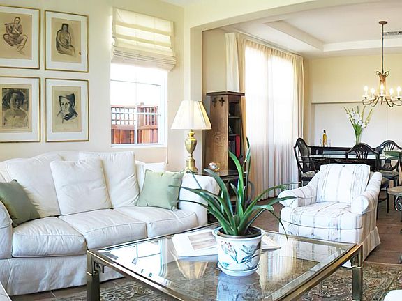 The house is largely open concept. This half of the bottom floor is living room and dining room. The washroom is behind those stairs.