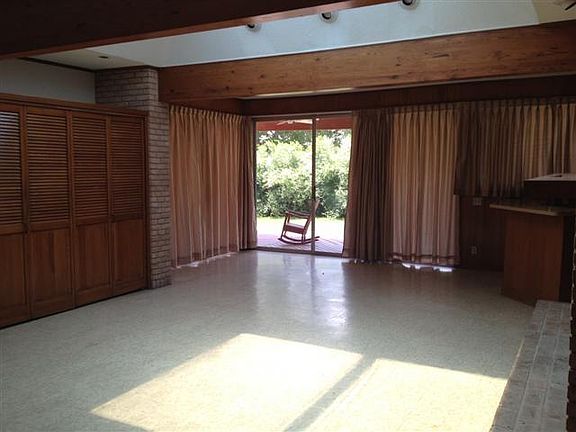 family room with large sliding glass doors to covered back p