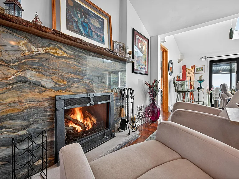 Push a button for instant fire for atmostphere and warmth. Swivel chair so you can talk to diners or look out at the lake.