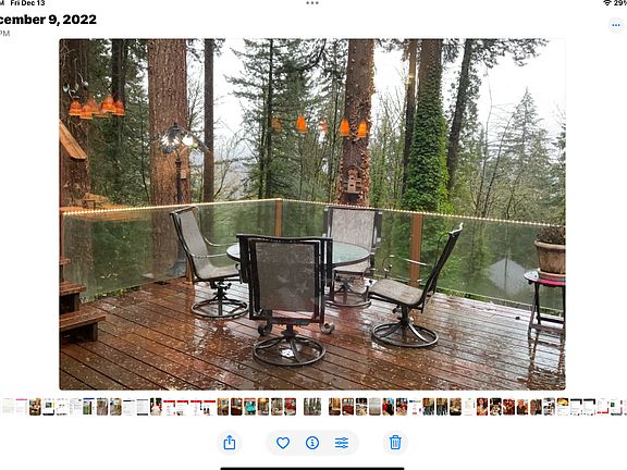 Deck off kitchen with glass railing