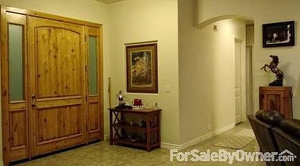 Foyer with 8' X 4' solid wood door