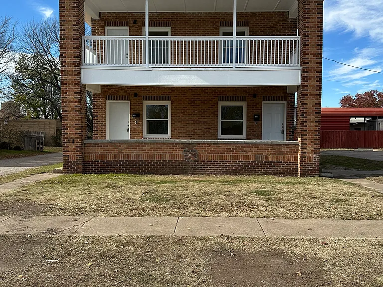 Front of the duplex. Right door goes to the upstairs unit front door.