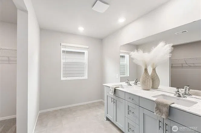 Master bathroom with walk-in closet and walk-in shower.