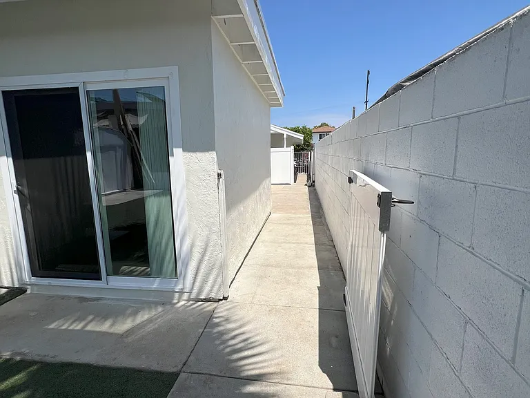 View of walkway from back yard