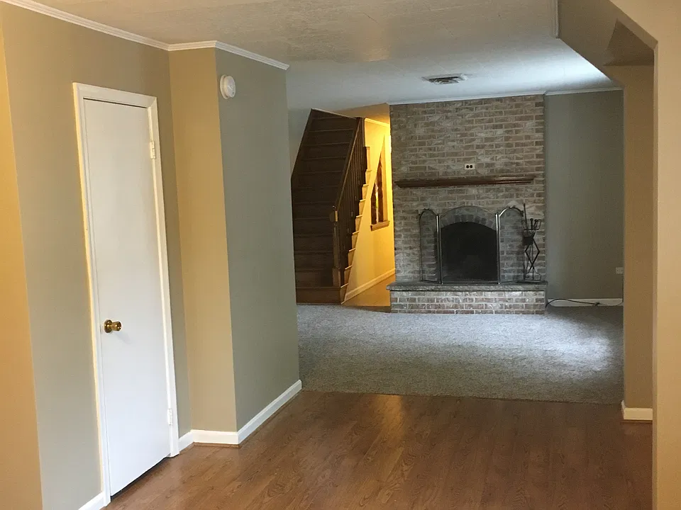 fireplace and oak staircase