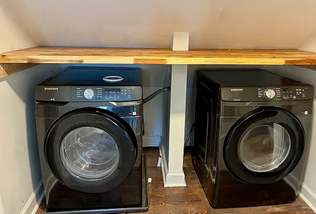 Large capacity washer/dryer in the unit, located in the hallway, between the two bedrooms