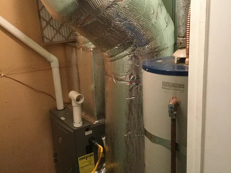 Utility closet. Forced air propane furnace. Propane water heater