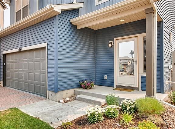 Beautiful floral landscaping. Note the addition of the convenient storm door.