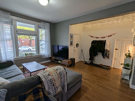 Living room, front door (left) & door to basement (right)