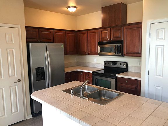 Stainless steel appliances & cherry cabinets