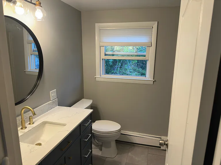 Full bathroom on second floor, recently renovated. Not shown: shower and bathtub, deep linen closet.