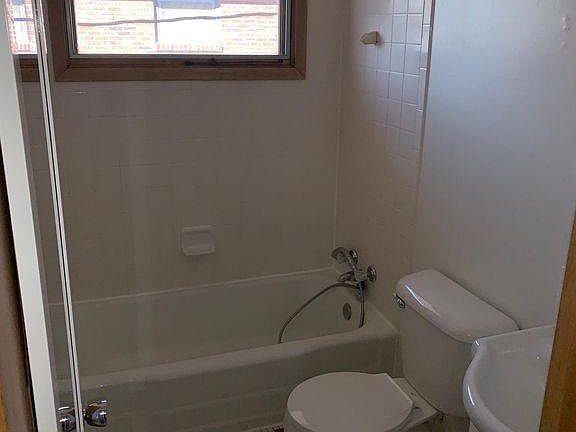 Bathroom with detachable shower head.