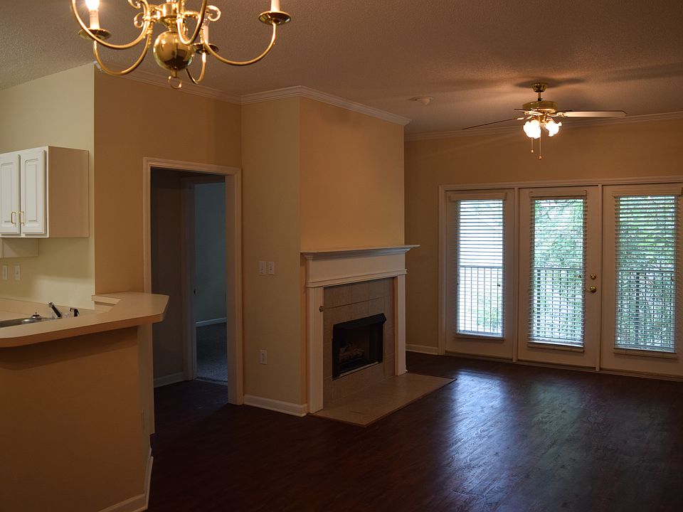 Joint kitchen and living room with gas fireplace.