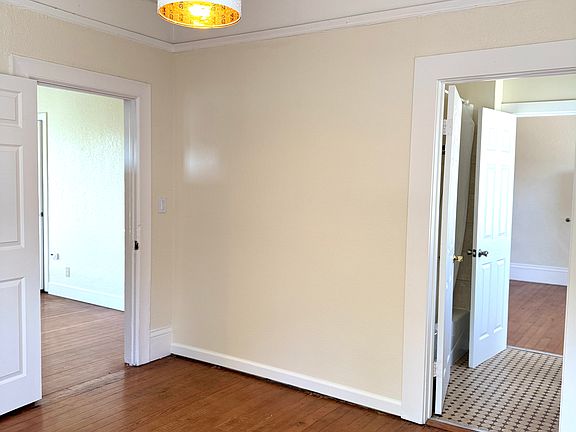 Another bright bedroom with access to the kitchen and bathroom.