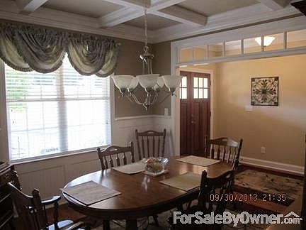 Beautifully Appointed Dining Room : Double Door Entry Showcases Dining Room with Coffered Ceiling an