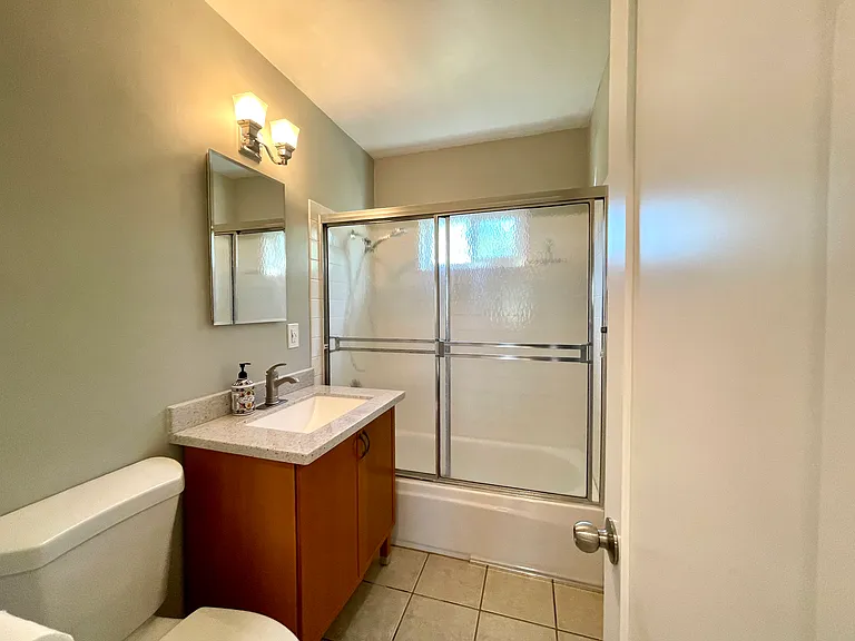 Bathroom with vanity cabinet storage.