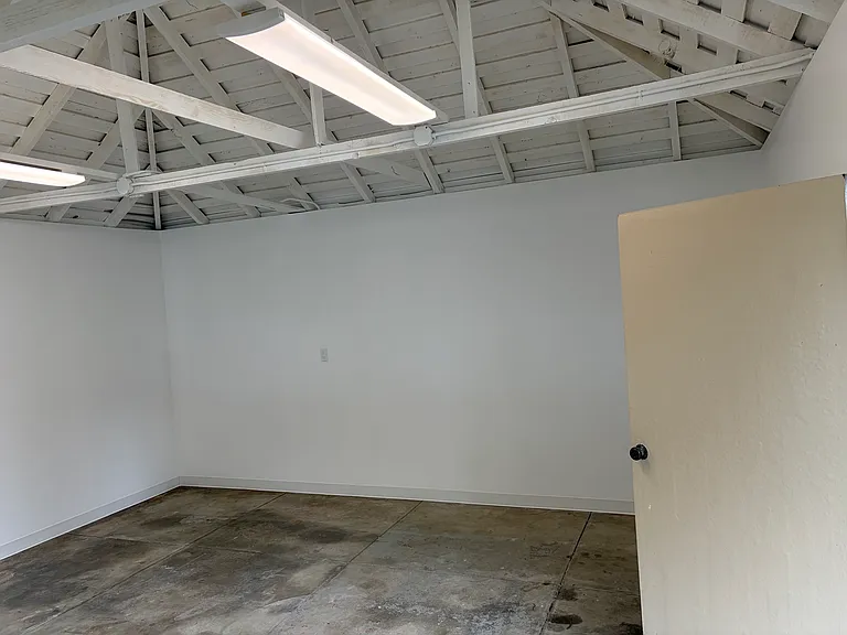 Two-car garage is finished and can be used for car parking, a workout area, a play or hobby area or just storage.