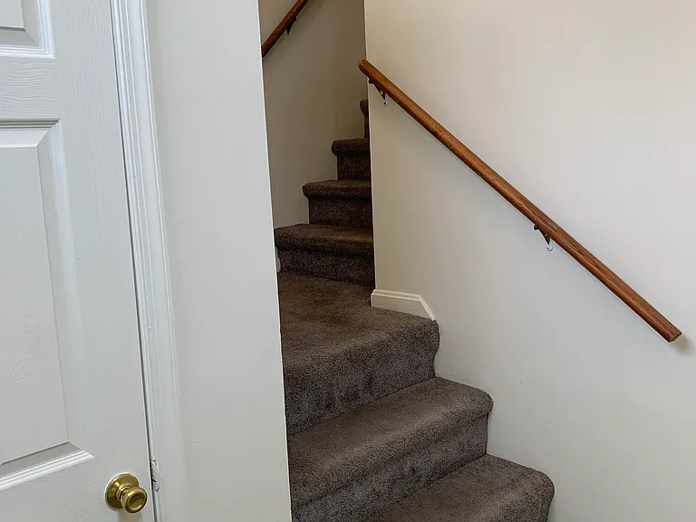 Entry level Closet. Stairs lead to the 1200 sqft 2 Bedroom duplex.