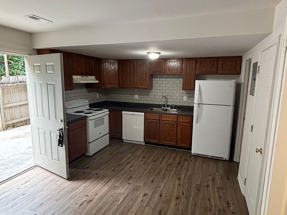 Kitchen with stove, fridge, dishwasher, and garbage disposal