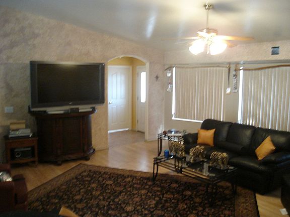 front entry into entertainers living room and kitchen