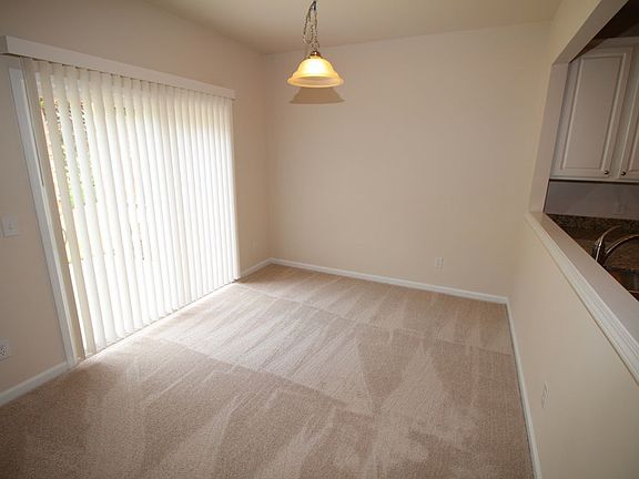 Dining room with open to kitchen and family room with slidin