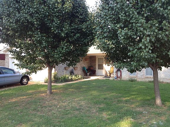 2 trees in front yard.