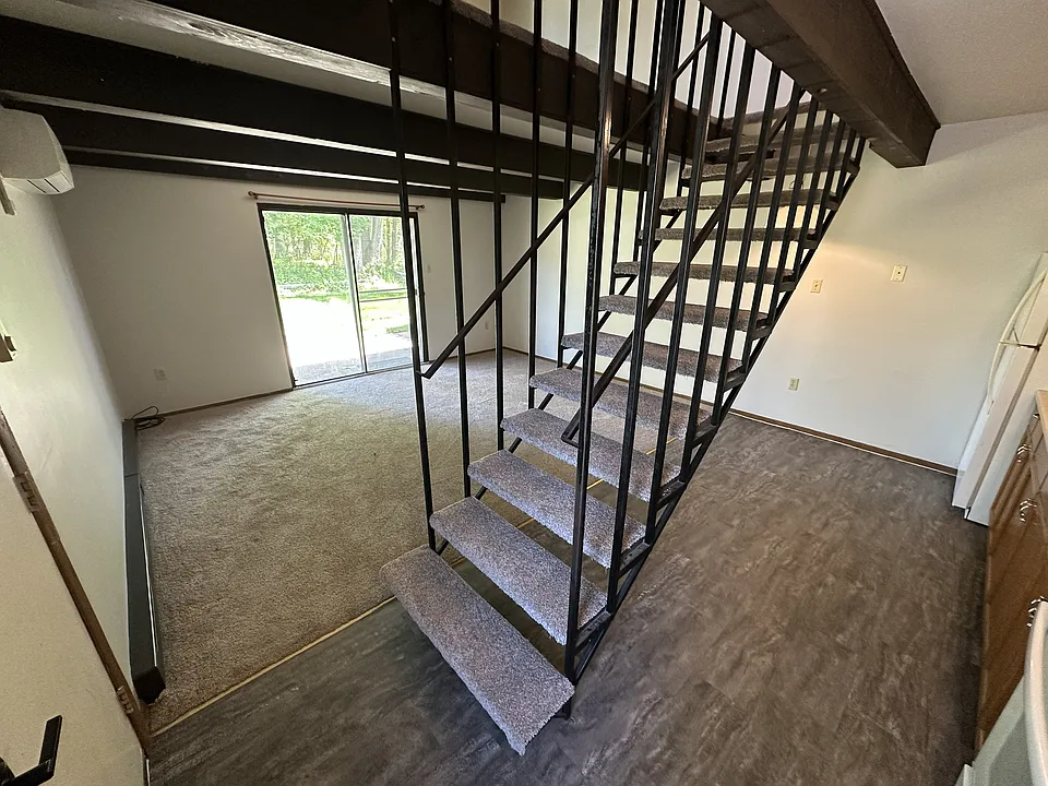 Living room and stairs to bedroom and bathroom