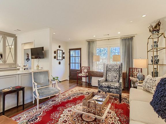 A farm table that seats 6 comfortably is nestled under the front windows. A 6-pane front door allows morning sun in to welcome the day!