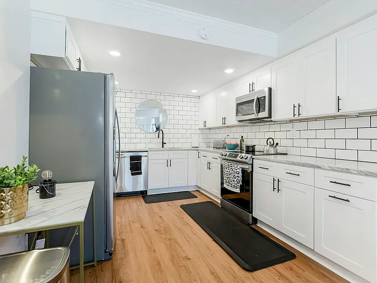 Brand new kitchen with stainless steel appliances (range, refrigerator, dishwasher and microwave)