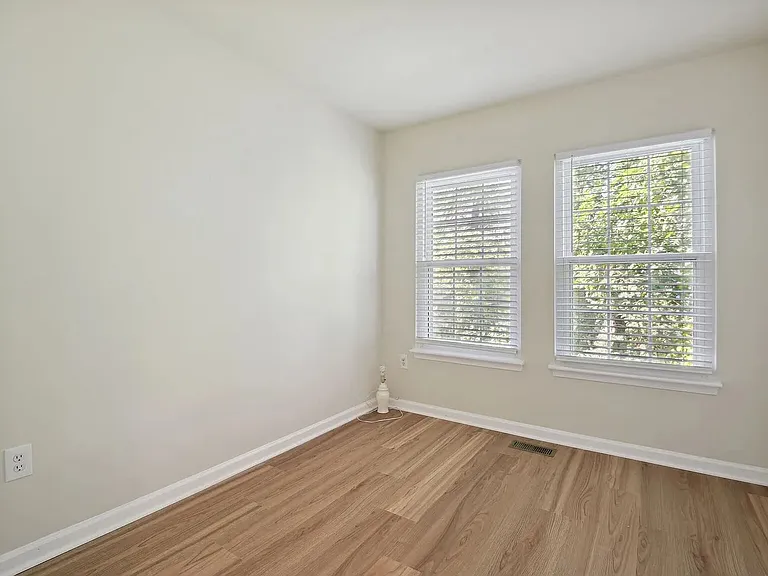 Overview of the second bedroom on the upper level (closet not shown)