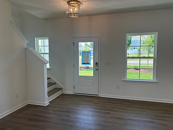 Family Room featuring the AW Collection R Roosevelt - Warm finishes make this room hosting-ready.