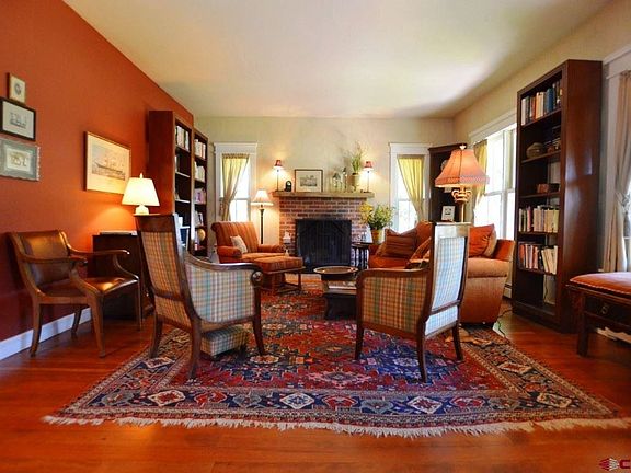 Wood burning fireplace accent this quaint living space.