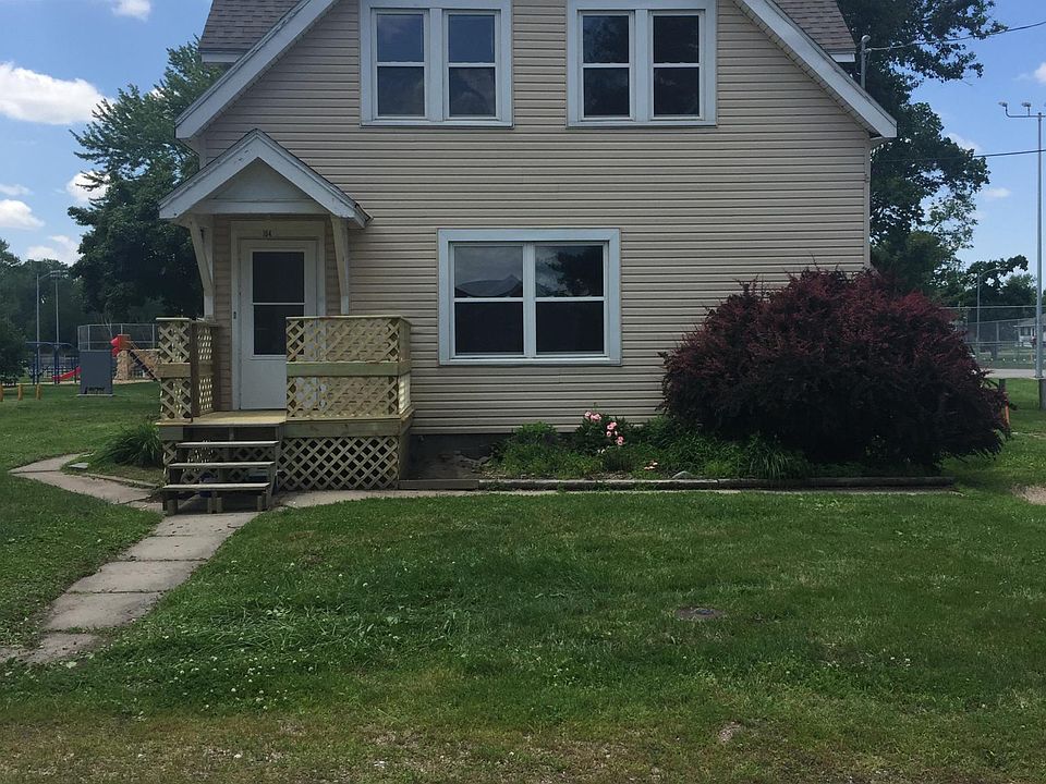 FRONT OF HOUSE AND HAS AN ATTACHED GARAGE ON THE RIGHT SIDE