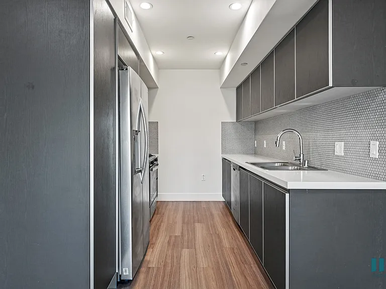 Kitchen with Stainless-Steel Refrigerator, Stove, Dishwasher, and Microwave Oven