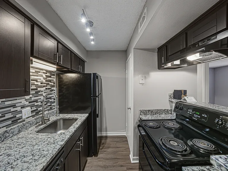 Updated one-bedroom apartment kitchen with modern finishes