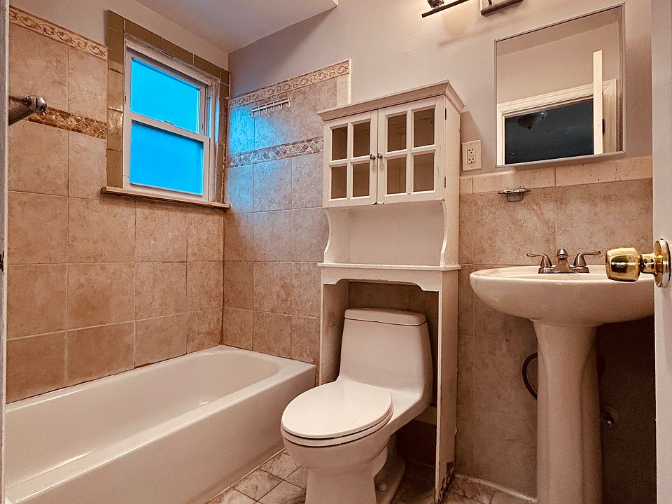 Well lit beautiful bathroom, with new tub, marble and nice tiles