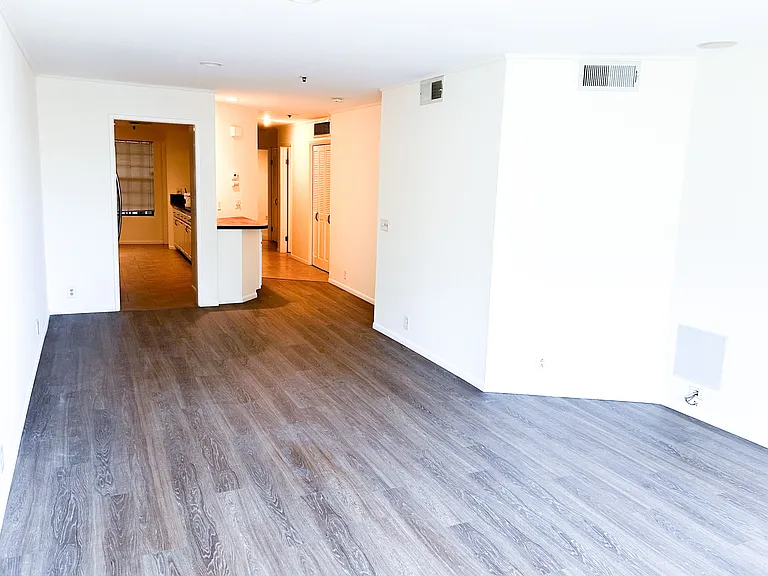 Main living area into kitchen, bar area and hallway