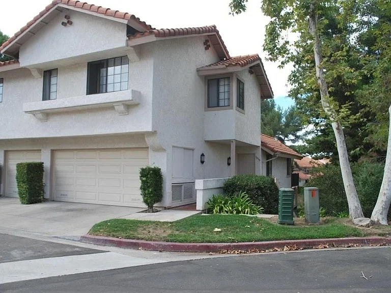 3030 Via Estrada...Bright & sunny end unit, two car garage,