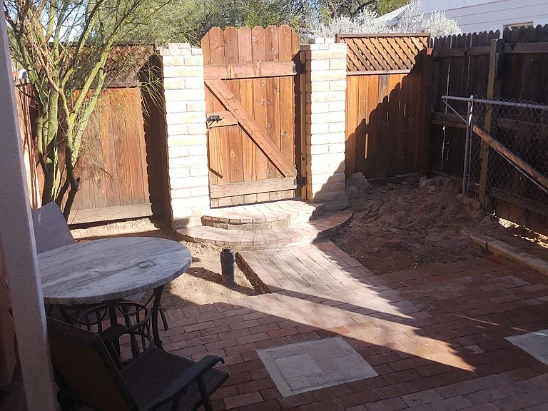 Private courtyard with patio set.