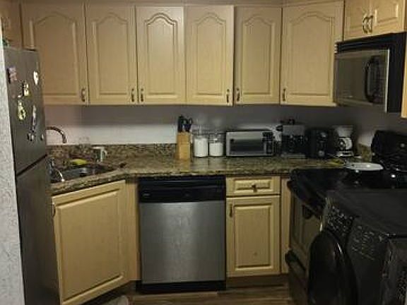 Kitchen with washer dryer 