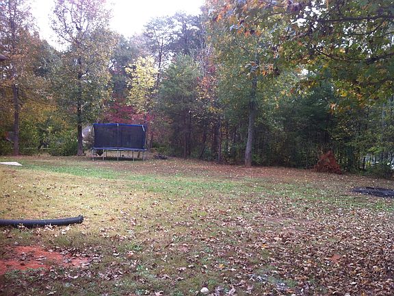 Wooded area is with property