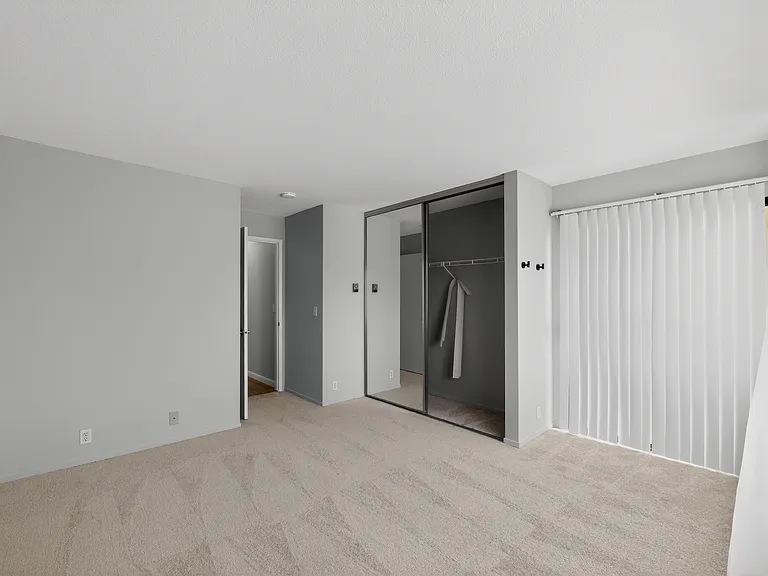 Bedroom 1 - Mirrored sliding closet doors.
