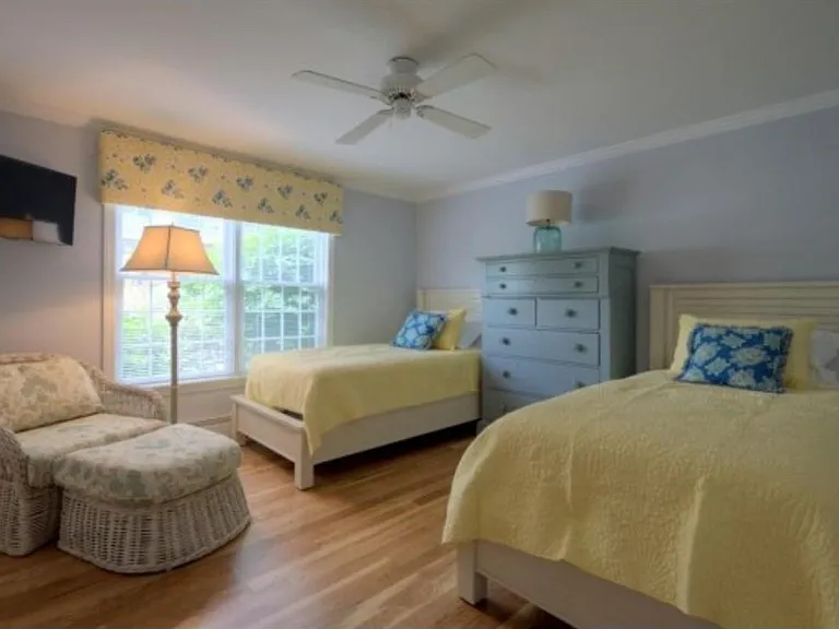 Second bedroom with comfortable chaise lounge chair and flat screen TV. Plenty of closet space for your clothes, blankets, linens and pillows are included