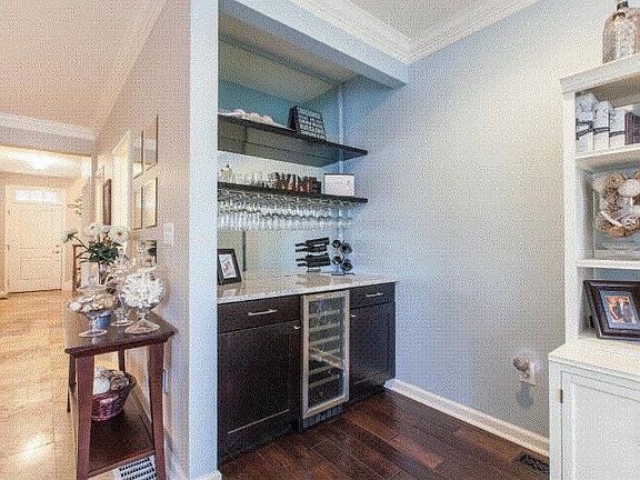 Dry Bar with wine refrigerator off of family room